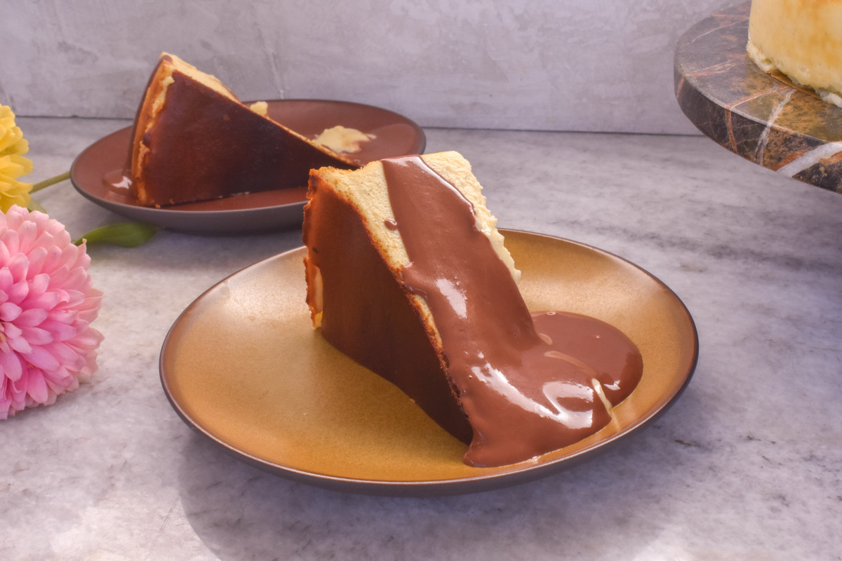 Slice of Basque Cheesecake with chocolate sauce